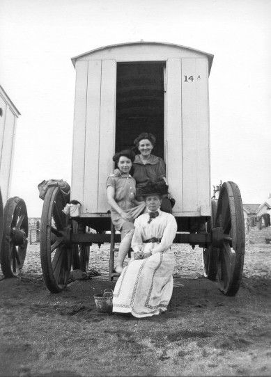 An Edwardian family beside a bathing hut. Teign Heritage Archive